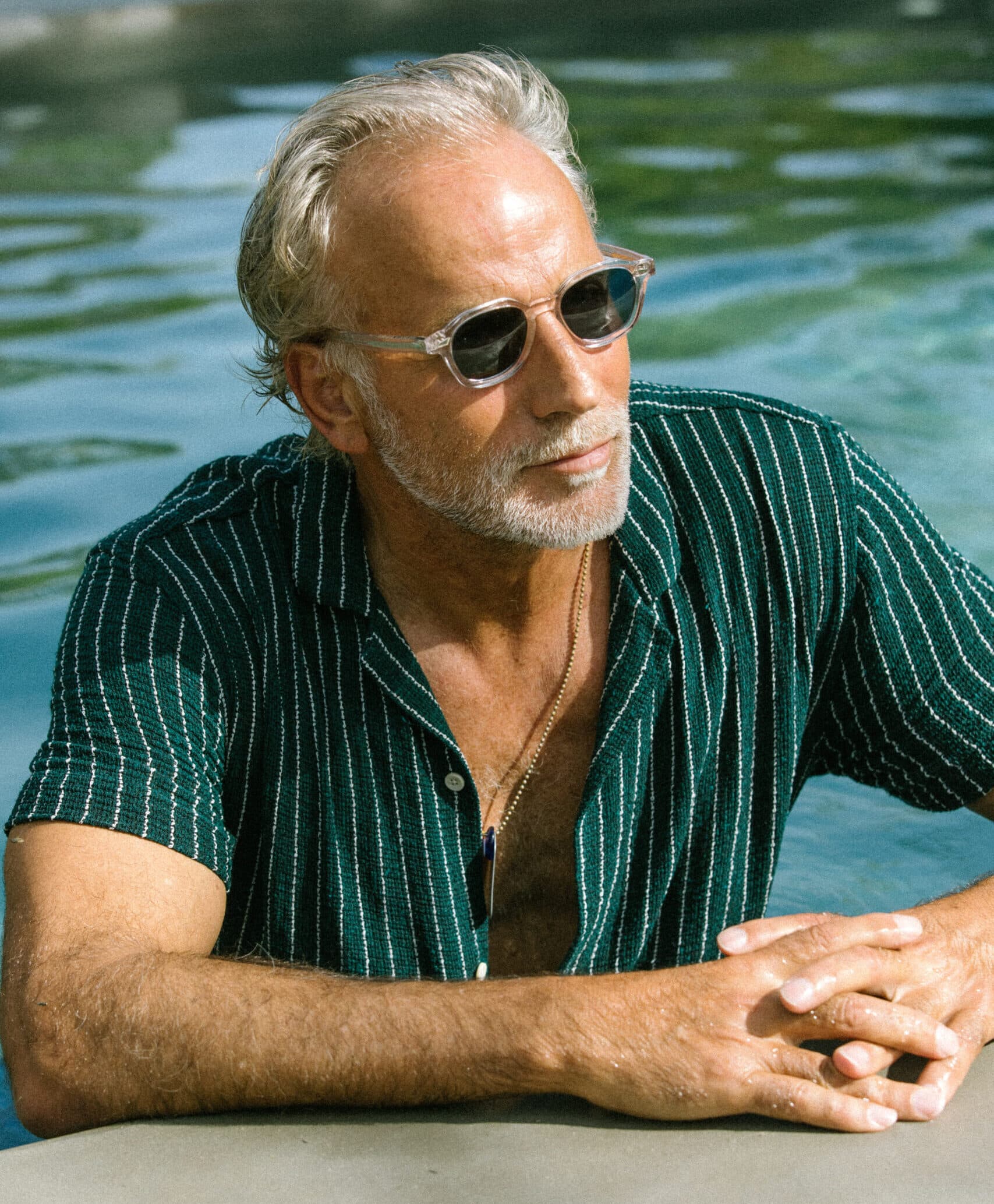 Gentleman in the pool wearing Dealer Sunglasses